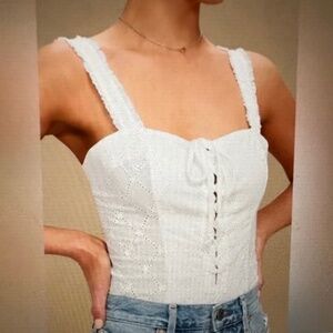 Free People Eyelet lace-up bodysuit.